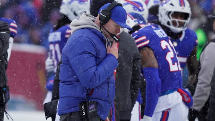 Buffalo Bills head coach Sean McDermott talks to a coach over the headset during first-half action at Highmark Stadium.