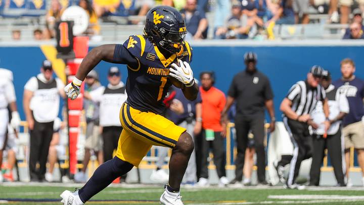 Sep 12, 2026; Morgantown, West Virginia, USA; West Virginia Mountaineers running back Amari Latimer (1) runs the ball for a touchdown during the third quarter against the UT Martin Skyhawks at Milan Puskar Stadium. Mandatory Credit: Ben Queen-Imagn Images Sep 12, 2026; Morgantown, West Virginia, USA; West Virginia Mountaineers running back Amari Latimer (1) runs the ball for a touchdown during the third quarter against the UT Martin Skyhawks at Milan Puskar Stadium. Mandatory Credit: Ben Queen-Imagn Images