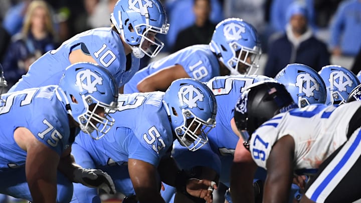 Nov 11, 2023; Chapel Hill, North Carolina, USA; North Carolina Tar Heels quarterback Drake Maye (10) at the line of scrimmage in the fourth quarter at Kenan Memorial Stadium. Mandatory Credit: Bob Donnan-USA TODAY Sports
