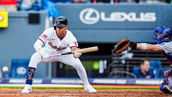 Cleveland Guardians second baseman Brayan Rocchio (4) lays down a bunt during the home opening game against the Chicago Cubs, April 4, 2026, at Progressive Field in Cleveland, Ohio. Cleveland Guardians second baseman Brayan Rocchio (4) lays down a bunt during the home opening game against the Chicago Cubs, April 4, 2026, at Progressive Field in Cleveland, Ohio.