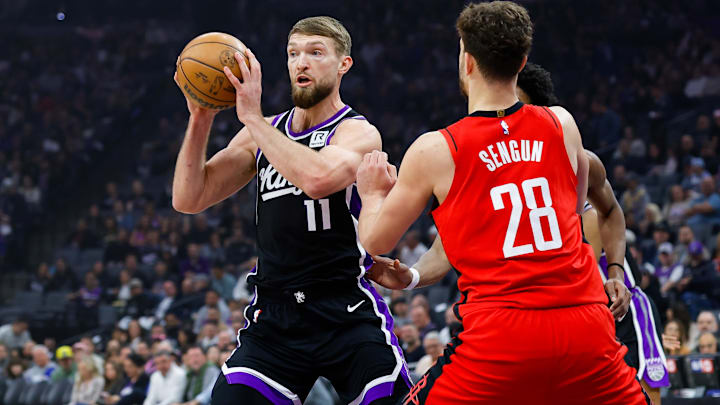 Jan 16, 2025; Sacramento, California, USA; Sacramento Kings forward Domantas Sabonis (11) controls the ball against Houston Rockets center Alperen Sengun (28) during the first quarter at Golden 1 Center. Mandatory Credit: Sergio Estrada-Imagn Images