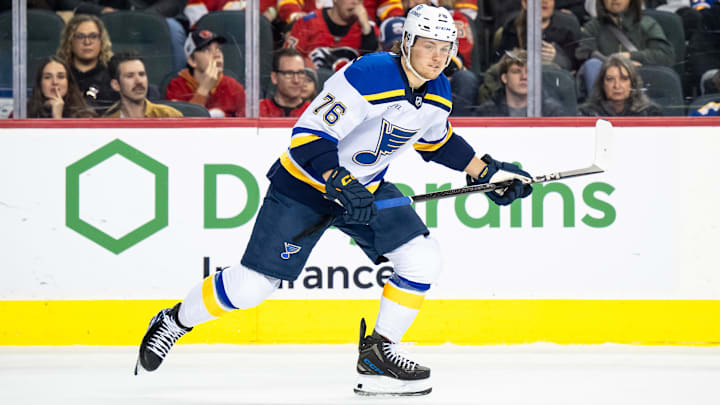 Dec 5, 2024; Calgary, Alberta, CAN; St. Louis Blues center Zachary Bolduc (76) skates against the Calgary Flames during the first period at Scotiabank Saddledome. Mandatory Credit: Brett Holmes-Imagn Images