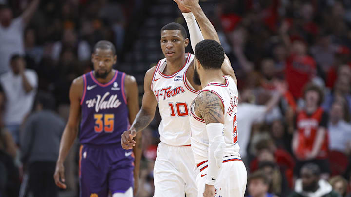 Feb 23, 2024; Houston, Texas, USA; Phoenix Suns forward Kevin Durant (35) reacts and Houston Rockets guard Fred VanVleet (5) celebrates with forward Jabari Smith Jr. (10) after a play during the third quarter at Toyota Center. Mandatory Credit: Troy Taormina-Imagn Images