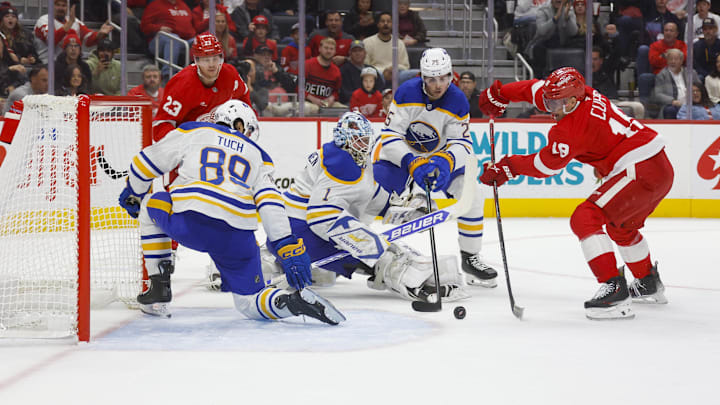 Nov 2, 2024; Detroit, Michigan, USA; Detroit Red Wings center Andrew Copp (18) shoots the puck against Buffalo Sabres goaltender Ukko-Pekka Luukkonen (1) during the second period  at Little Caesars Arena. Mandatory Credit: Brian Bradshaw Sevald-Imagn Images