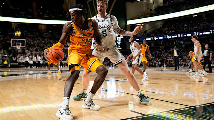 Missouri guard Mark Mitchell (25) is guarded by Vanderbilt guard Tyler Nickel (5) during the second half at Memorial Gym in Nashville, Tenn., Saturday, March 1, 2025. Missouri guard Mark Mitchell (25) is guarded by Vanderbilt guard Tyler Nickel (5) during the second half at Memorial Gym in Nashville, Tenn., Saturday, March 1, 2025.