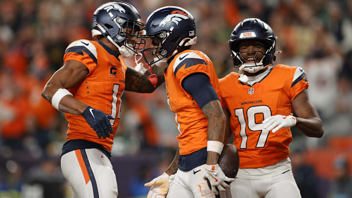 Dec 14, 2025; Denver, Colorado, USA; Denver Broncos wide receiver Troy Franklin (11), wide receiver Courtland Sutton (14) and wide receiver Marvin Mims Jr. (19) celebrate a touchdown during the third quarter against the Green Bay Packers at Empower Field at Mile High. Dec 14, 2025; Denver, Colorado, USA; Denver Broncos wide receiver Troy Franklin (11), wide receiver Courtland Sutton (14) and wide receiver Marvin Mims Jr. (19) celebrate a touchdown during the third quarter against the Green Bay Packers at Empower Field at Mile High.
