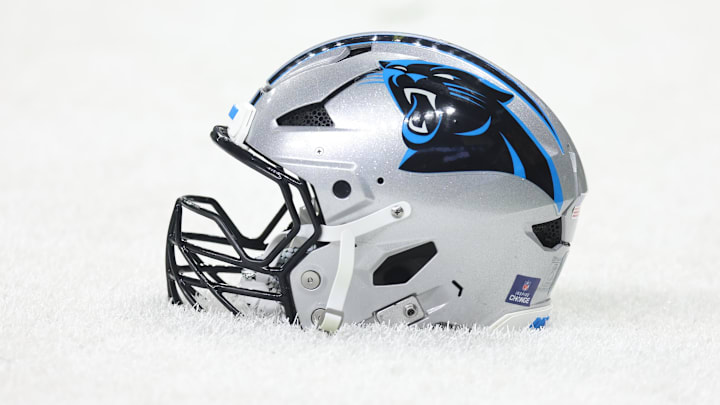 Dec 14, 2025; New Orleans, Louisiana, USA; Detailed shot of a Carolina Panthers helmet on the grass before the game against the New Orleans Saints at Caesars Superdome. Mandatory Credit: Stephen Lew-Imagn Images