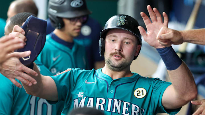 Sep 16, 2025; Kansas City, Missouri, USA; Seattle Mariners catcher Cal Raleigh (29) is congratulated by teammates after hitting a home run in the first inning against the Kansas City Royals at Kauffman Stadium. Mandatory Credit: Scott Sewell-Imagn Images