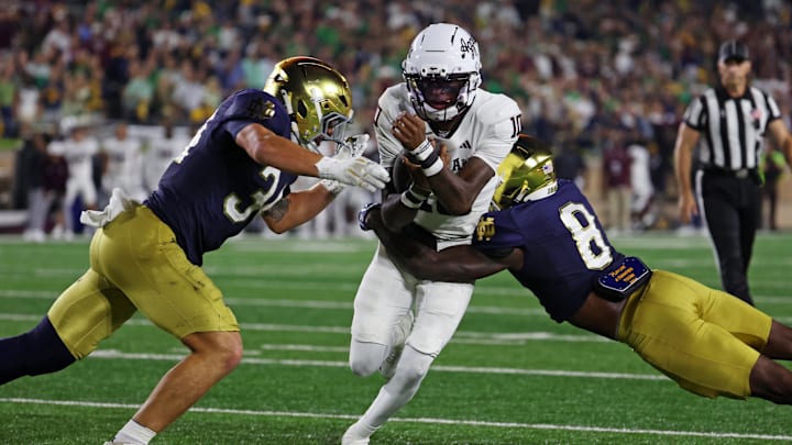 Texas A&M Aggies quarterback Marcel Reed (10) runs the ball as Notre Dame Fighting Irish safety Adon Shuler (8) goes for a tackle during the second half at Notre Dame Stadium. Credit: Trevor Ruszkowski-Imagn Images
