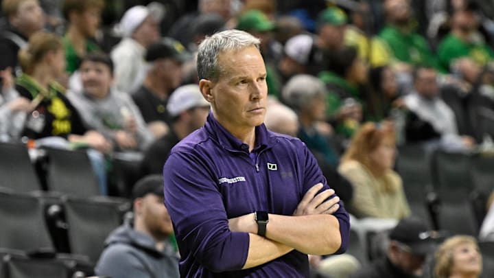 Feb 11, 2025; Eugene, Oregon, USA; Northwestern Wildcats head coach Chris Collins watches his team during the second half against the Oregon Ducks at Matthew Knight Arena. Mandatory Credit: Craig Strobeck-Imagn Images