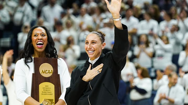 Jan 27, 2024; Storrs, Connecticut, USA; WNBA player and former UConn Huskies player Diana Taurasi waves to the crowd as she and other players are recognized for their championship wins at UConn before the start of the game against the Notre Dame Fighting Irish at Harry A. Gampel Pavilion. Mandatory Credit: David Butler II-Imagn Images