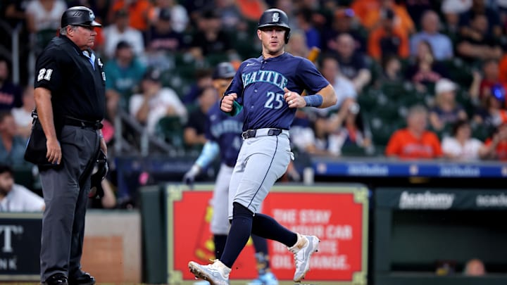 Seattle Mariners third baseman Dylan Moore scores during a game against the Houston Astros on Wednesday at Minute Maid Park.