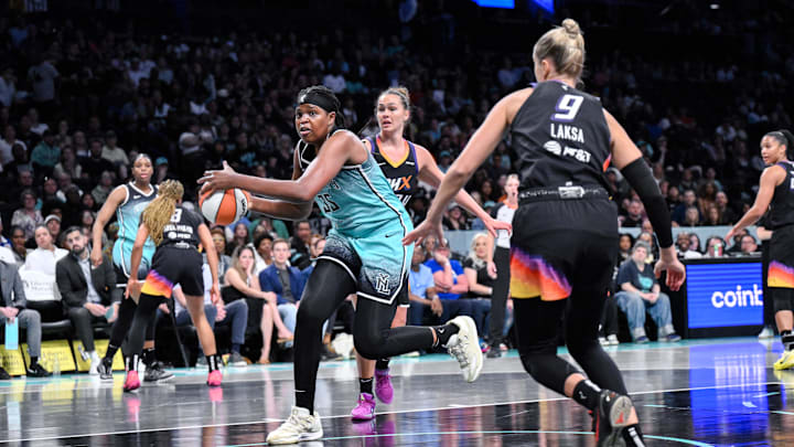 New York Liberty center Jones drives to the basket as Phoenix Mercury forward Westbeld and guard Laksa defend at Barclays Center. 