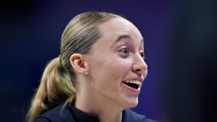 Aug 8, 2025; Arlington, Texas, USA; Dallas Wings guard Paige Bueckers (5) laughs with her teammates during the second half against the New York Liberty at College Park Center. Mandatory Credit: Jerome Miron-Imagn Images