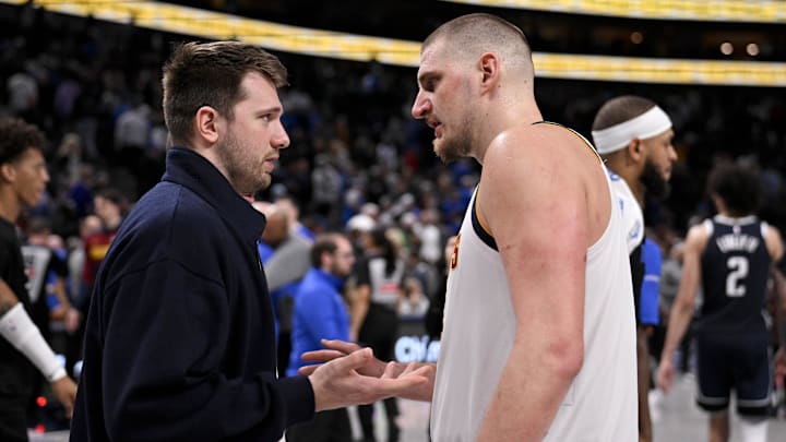 Jan 12, 2025; Dallas, Texas, USA; Dallas Mavericks guard Luka Doncic (left) talks with Denver Nuggets center Nikola Jokic (right) after the game at the American Airlines Center. Mandatory Credit: Jerome Miron-Imagn Images