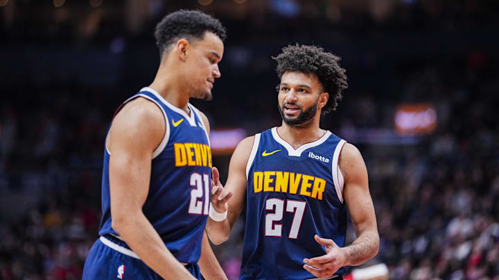 Dec 31, 2025; Toronto, Ontario, CAN; Denver Nuggets guard Jamal Murray (27) stands beside forward Spencer Jones (21) during a break in play against the Toronto Raptors during the second half at Scotiabank Arena. Mandatory Credit: Kevin Sousa-Imagn Images