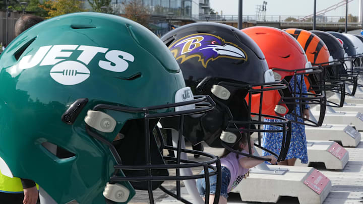 Oct 7, 2023; London, United Kingdom; Large oversized helmets of the New York Jets Baltimore Ravens, Cleveland Browns and Cincinnati Bengals at the NFL Experience London at the Battersea Power Station. Mandatory Credit: Kirby Lee-Imagn Images