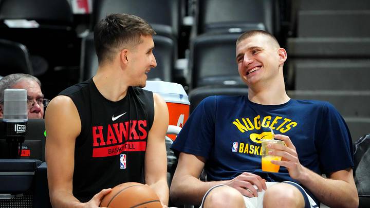 Feb 4, 2023; Denver, Colorado, USA; Atlanta Hawks guard Bogdan Bogdanovic (13) speaks to Denver Nuggets center Nikola Jokic (15) before the game at Ball Arena. Feb 4, 2023; Denver, Colorado, USA; Atlanta Hawks guard Bogdan Bogdanovic (13) speaks to Denver Nuggets center Nikola Jokic (15) before the game at Ball Arena.