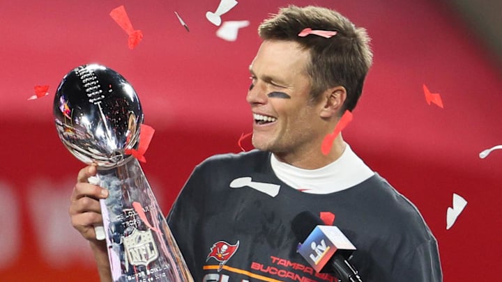 Feb 7, 2021; Tampa, FL, USA; Tampa Bay Buccaneers quarterback Tom Brady (12) hoists the Vince Lombardi Trophy after defeating the Kansas City Chiefs in Super Bowl LV at Raymond James Stadium. Mandatory Credit: Matthew Emmons-Imagn Images Feb 7, 2021; Tampa, FL, USA; Tampa Bay Buccaneers quarterback Tom Brady (12) hoists the Vince Lombardi Trophy after defeating the Kansas City Chiefs in Super Bowl LV at Raymond James Stadium. Mandatory Credit: Matthew Emmons-Imagn Images