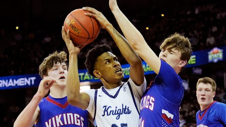 Nicolet's Davion Hannah (25) is guarded by Wisconsin Lutheran's Trey Raabe (14) and Zavier Zens (23) during the first half of the WIAA Division 2 boys basketball state semifinal game on Friday March 15, 2024 at the Kohl Center in Madison, Wis. Nicolet's Davion Hannah (25) is guarded by Wisconsin Lutheran's Trey Raabe (14) and Zavier Zens (23) during the first half of the WIAA Division 2 boys basketball state semifinal game on Friday March 15, 2024 at the Kohl Center in Madison, Wis.