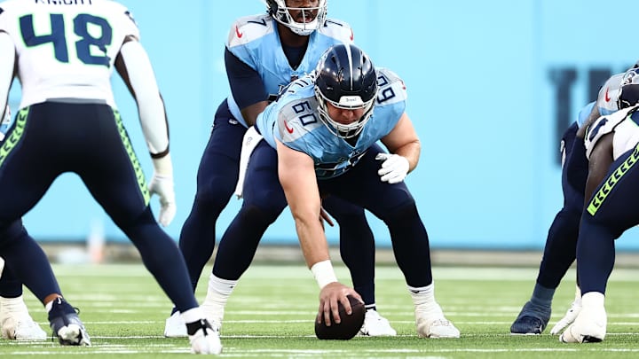 Tennessee Titans offensive tackle Daniel Brunskill (60) and quarterback Malik Willis (7) set up for a snap in the second quarter against the Seattle Seahawks at Nissan Stadium. Tennessee Titans offensive tackle Daniel Brunskill (60) and quarterback Malik Willis (7) set up for a snap in the second quarter against the Seattle Seahawks at Nissan Stadium.
