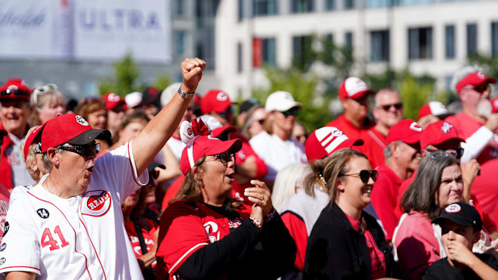 Fans cheer during a statue unveiling for former Cincinnati Reds sportscaster Marty Brennaman at Croseley Terrace, Saturday, Sept. 6, 2025, at Great American Ball Park in downtown Cincinnati.