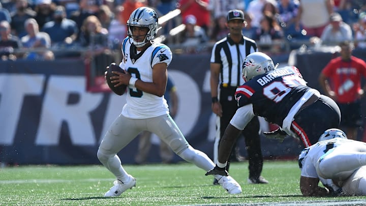 Sep 28, 2025; Foxborough, Massachusetts, USA; Carolina Panthers quarterback Bryce Young (9) eludes the tackle of New England Patriots defensive tackle Christian Barmore (90) during the first half at Gillette Stadium. Mandatory Credit: Bob DeChiara-Imagn Images Sep 28, 2025; Foxborough, Massachusetts, USA; Carolina Panthers quarterback Bryce Young (9) eludes the tackle of New England Patriots defensive tackle Christian Barmore (90) during the first half at Gillette Stadium. Mandatory Credit: Bob DeChiara-Imagn Images