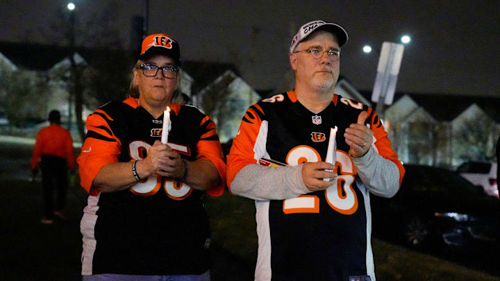 Janet Kohl of Mt. Healthy and her brother, Chuck Kohl show support outside of University of