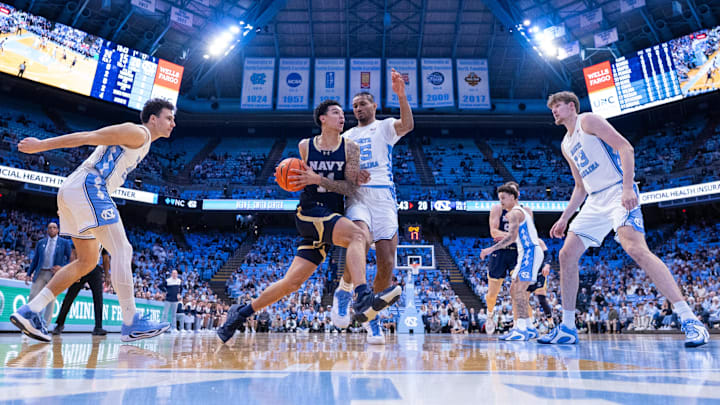 Nov 18, 2025; Chapel Hill, North Carolina, USA; Navy Midshipmen forward Donovan Draper (11) drives to the basket against North Carolina Tar Heels forward Jarin Stevenson (15) during the first half at Dean E. Smith Center. Mandatory Credit: Scott Kinser-Imagn Images Nov 18, 2025; Chapel Hill, North Carolina, USA; Navy Midshipmen forward Donovan Draper (11) drives to the basket against North Carolina Tar Heels forward Jarin Stevenson (15) during the first half at Dean E. Smith Center. Mandatory Credit: Scott Kinser-Imagn Images