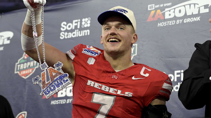 UNLV Rebels linebacker Jackson Woodard (7) celebrates after he was named offensive player of the game after defeating the California Golden Bears in the LA Bowl at SoFi Stadium. Mandatory Credit: Jayne Kamin-Oncea-Imagn Images UNLV Rebels linebacker Jackson Woodard (7) celebrates after he was named offensive player of the game after defeating the California Golden Bears in the LA Bowl at SoFi Stadium. Mandatory Credit: Jayne Kamin-Oncea-Imagn Images
