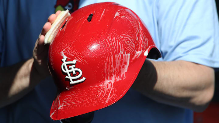 Apr 9, 2025; Pittsburgh, Pennsylvania, USA;  The St. Louis Cardinals equipment manger scrubs the team batting helmets before the game against the Pittsburgh Pirates at PNC Park. Mandatory Credit: Charles LeClaire-Imagn Images