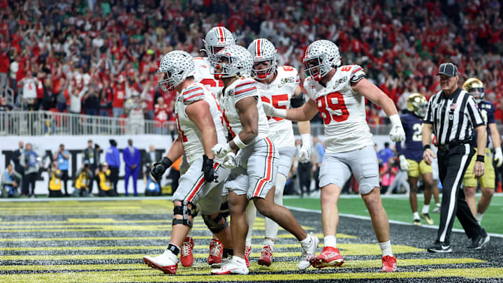 Jan 20, 2025; Atlanta, GA, USA; Ohio State Buckeyes running back Quinshon Judkins (1) celebrates with teammates after scoring a touchdown against the Notre Dame Fighting Irish during the first half the CFP National Championship college football game at Mercedes-Benz Stadium. Mandatory Credit: Mark J. Rebilas-Imagn Images