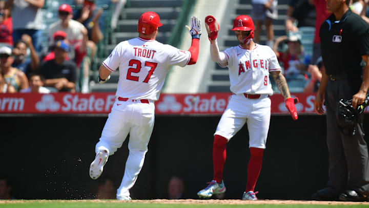 Jun 11, 2025; Anaheim, California, USA; Los Angeles Angels designated hitter Mike Trout (27) is greeted by shortstop Zach Neto (9) after scoring a run against the Athletics during the sixth inning at Angel Stadium. Mandatory Credit: Gary A. Vasquez-Imagn Images Jun 11, 2025; Anaheim, California, USA; Los Angeles Angels designated hitter Mike Trout (27) is greeted by shortstop Zach Neto (9) after scoring a run against the Athletics during the sixth inning at Angel Stadium. Mandatory Credit: Gary A. Vasquez-Imagn Images
