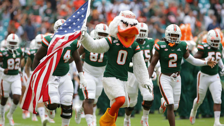 Sep 21, 2019; Miami Gardens, FL, USA; Miami Hurricanes mascot Sebastian the Ibis carries a U.S. flag as the Miami Hurricanes football team take the field to face the Central Michigan Chippewas at Hard Rock Stadium. Mandatory Credit: Sam Navarro-USA TODAY Sports