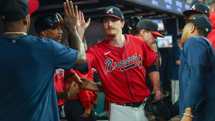 Sep 27, 2024; Atlanta, Georgia, USA; Atlanta Braves starting pitcher Max Fried (54) is congratulated by teammates after being removed from a game against the Kansas City Royals in the ninth inning at Truist Park. Mandatory Credit: Brett Davis-Imagn Images