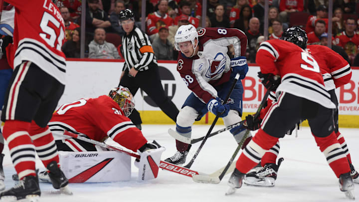 Apr 2, 2025; Chicago, Illinois, USA; Colorado Avalanche center Martin Necas (88) takes a shot on goal past Chicago Blackhawks goaltender Spencer Knight (30) during the second period at United Center. Mandatory Credit: Talia Sprague-Imagn Images