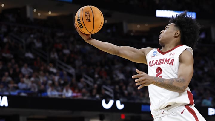 Mar 21, 2025; Cleveland, OH, USA; Alabama Crimson Tide guard Aden Holloway (2) shoots the ball in the second half during the NCAA Tournament First Round at Rocket Arena. Mandatory Credit: Rick Osentoski-Imagn Images