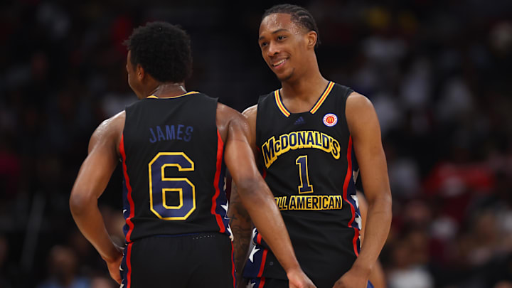 Mar 28, 2023; Houston, TX, USA; West guard Bronny James (6) and forward Ron Holland (1) react during the McDonald's All American Boy's high school basketball game at Toyota Center. Mandatory Credit: Mark J. Rebilas-Imagn Images