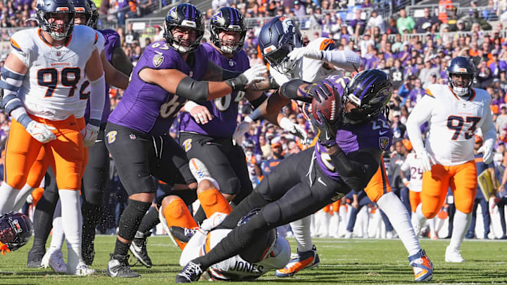 Nov 3, 2024; Baltimore, Maryland, USA; Baltimore Ravens running back Derrick Henry (22) runs for a first quarter touchdown against the Denver Broncos at M&T Bank Stadium. Mandatory Credit: Mitch Stringer-Imagn Images