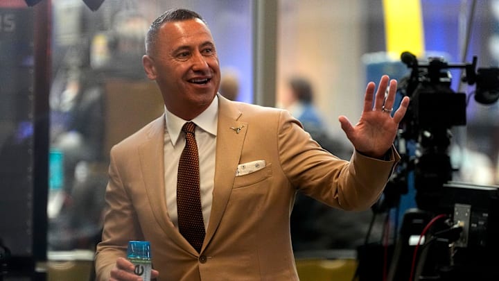 July 15, 2025; Atlanta, GA, USA; Texas head coach Steve Sarkisian waves to fans during SEC Media Days at the College Football Hall of Fame in Atlanta.