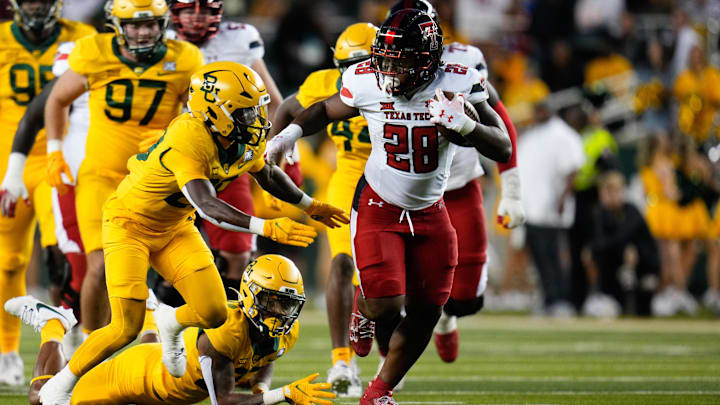 Oct 7, 2023; Waco, Texas, USA; Texas Tech Red Raiders running back Tahj Brooks (28) runs the ball upfield against the Baylor Bears during the first half at McLane Stadium. Mandatory Credit: Chris Jones-USA TODAY Sports