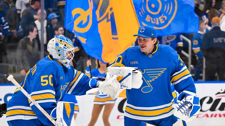 Mar 28, 2026; St. Louis, Missouri, USA; St. Louis Blues goaltender Jordan Binnington (50) is congratulated by goaltender Joel Hofer (30) after the Blues defeated the Toronto Maple Leafs at Enterprise Center. Mandatory Credit: Jeff Curry-Imagn Images