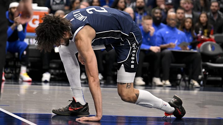 Jan 14, 2025; Dallas, Texas, USA; Dallas Mavericks center Dereck Lively II (2) reacts after suffering a possible leg injury during the first quarter against the Denver Nuggets at the American Airlines Center. Mandatory Credit: Jerome Miron-Imagn Images