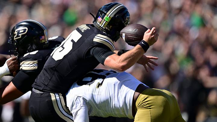 Purdue Boilermakers quarterback Ryan Browne (15) is sacked by Notre Dame. Purdue Boilermakers quarterback Ryan Browne (15) is sacked by Notre Dame.