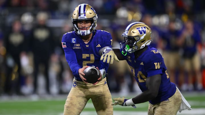 The Huskies are home underdogs against Oregon in college football Week 14 action.