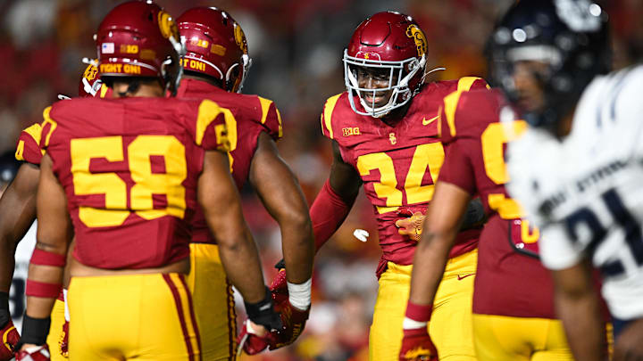 Sep 7, 2024; Los Angeles, California, USA; USC Trojans defensive end Braylan Shelby (34) celebrates after Utah State Aggies quarterback Bryson Barnes (16) (not pictured) is sacked during the third quarter at United Airlines Field at Los Angeles Memorial Coliseum. Mandatory Credit: Jonathan Hui-Imagn Images