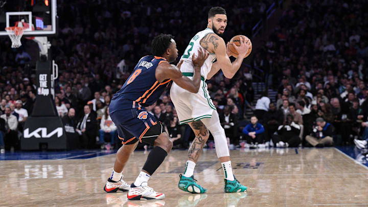 Apr 8, 2025; New York, New York, USA; Boston Celtics forward Jayson Tatum (0) sets the play while being defended by New York Knicks forward OG Anunoby (8) during the second half at Madison Square Garden. Mandatory Credit: John Jones-Imagn Images