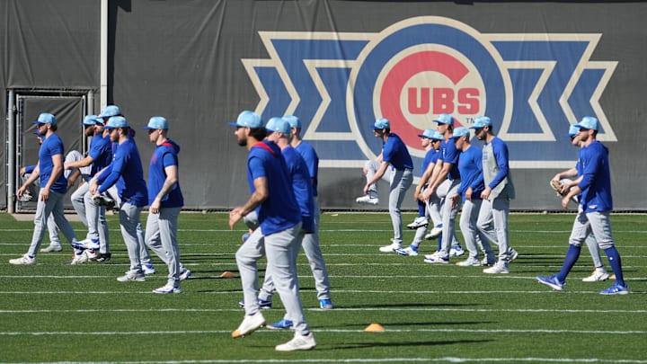 Feb 10, 2025; Mesa, AZ, USA; Chicago Cubs pitchers warm up during spring training camp. Rick Scuteri-Imagn Images