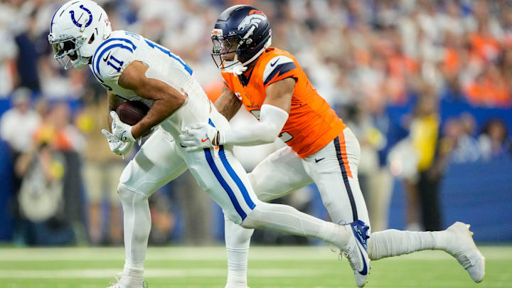 Denver Broncos cornerback Pat Surtain II (2) chases after Indianapolis Colts wide receiver Michael Pittman Jr. (11) on Sunday, Sept. 14, 2025, during a game at Lucas Oil Stadium in Indianapolis. Denver Broncos cornerback Pat Surtain II (2) chases after Indianapolis Colts wide receiver Michael Pittman Jr. (11) on Sunday, Sept. 14, 2025, during a game at Lucas Oil Stadium in Indianapolis.