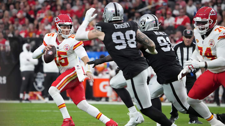 Nov 26, 2023; Paradise, Nevada, USA; Kansas City Chiefs quarterback Patrick Mahomes (15) is pressured by Las Vegas Raiders defensive end Maxx Crosby (98) and defensive tackle Bilal Nichols (91) in the first half at Allegiant Stadium. Mandatory Credit: Kirby Lee-Imagn Images Nov 26, 2023; Paradise, Nevada, USA; Kansas City Chiefs quarterback Patrick Mahomes (15) is pressured by Las Vegas Raiders defensive end Maxx Crosby (98) and defensive tackle Bilal Nichols (91) in the first half at Allegiant Stadium. Mandatory Credit: Kirby Lee-Imagn Images